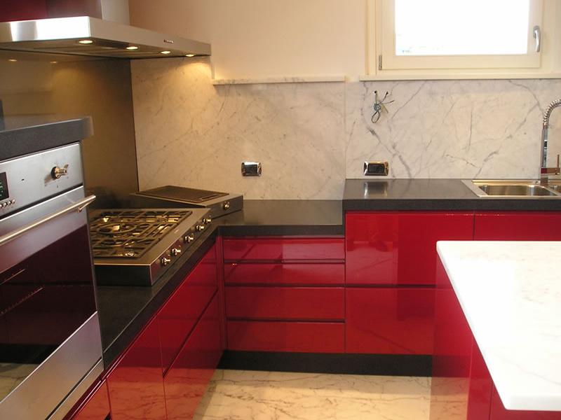 Glossy lacquered kitchen with island and marble top