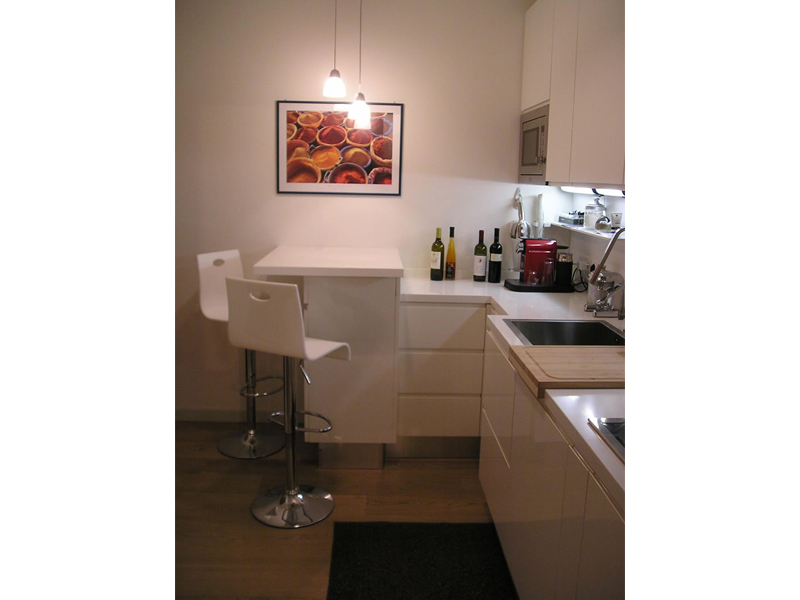 Modern kitchen cabinets, lacquer, with Corian top